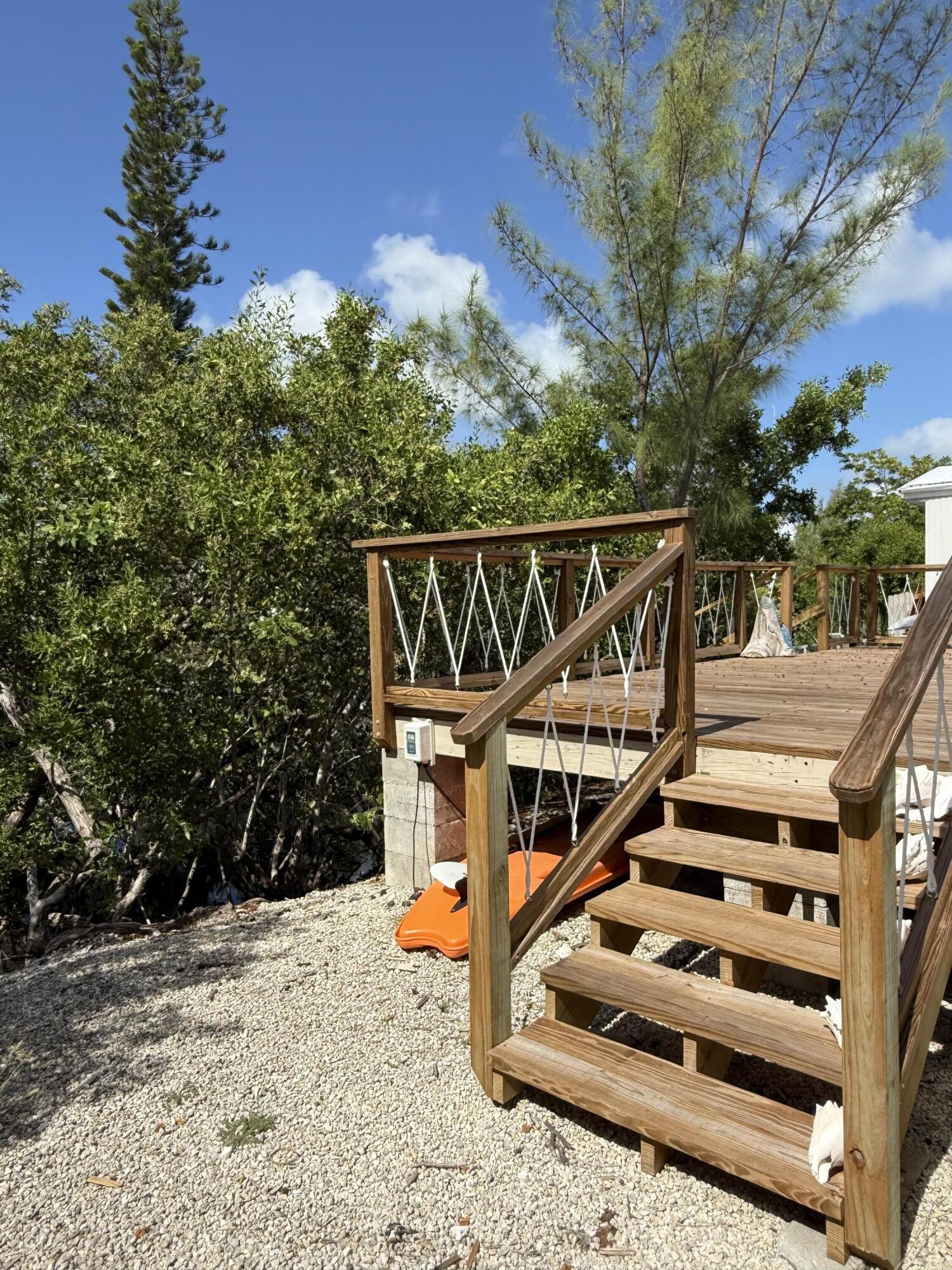 27960 Porgie Path Summerland Key, FL 33042 - Photo 9 of 30 a view of balcony with wooden floor and fence