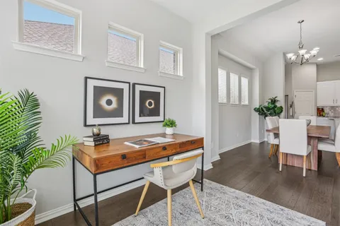 a dining room with furniture and window