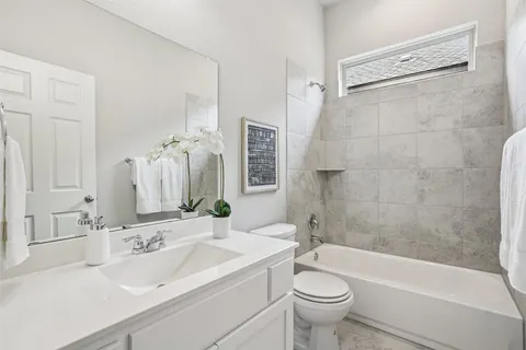 a bathroom with a sink a toilet and a bathtub