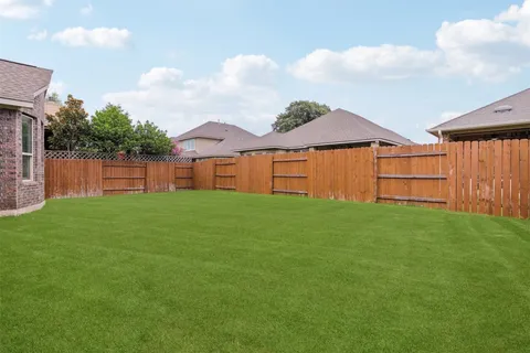 a view of a backyard with a garden