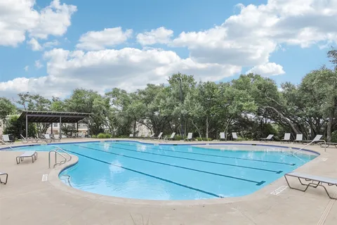 a view of a swimming pool with a terrace