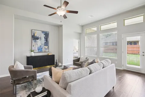 a living room with furniture and a large window