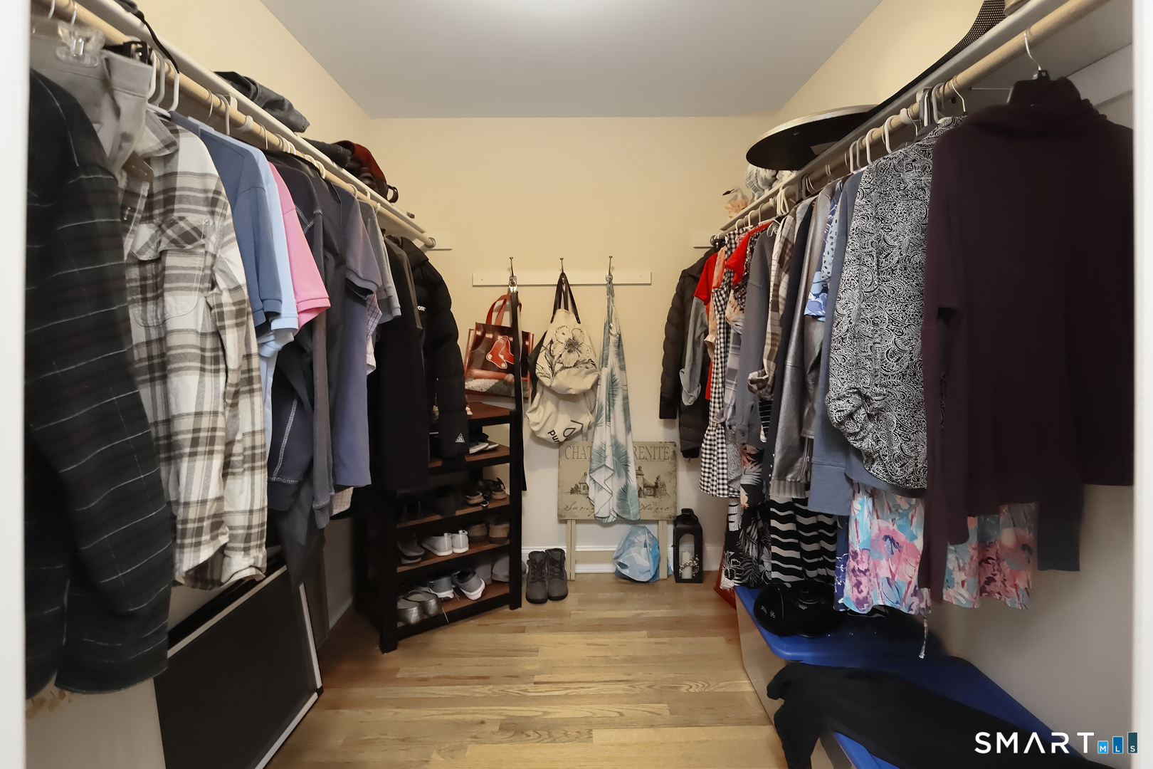 102 Lantern Court, Unit 102 Clinton, CT 06413 - Photo 35 of 36 a view of walk in closet with clothes and shoes