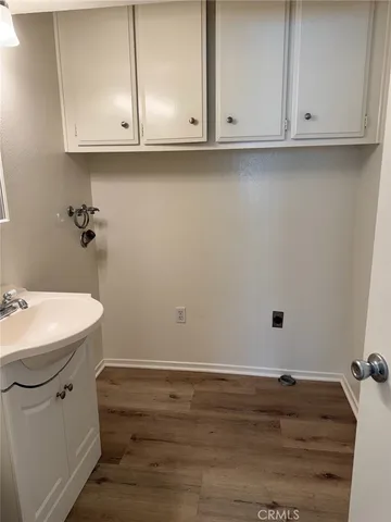 a bathroom with a sink and cabinets