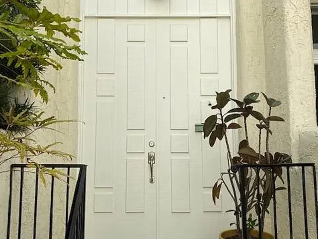 a view of staircase with white walls
