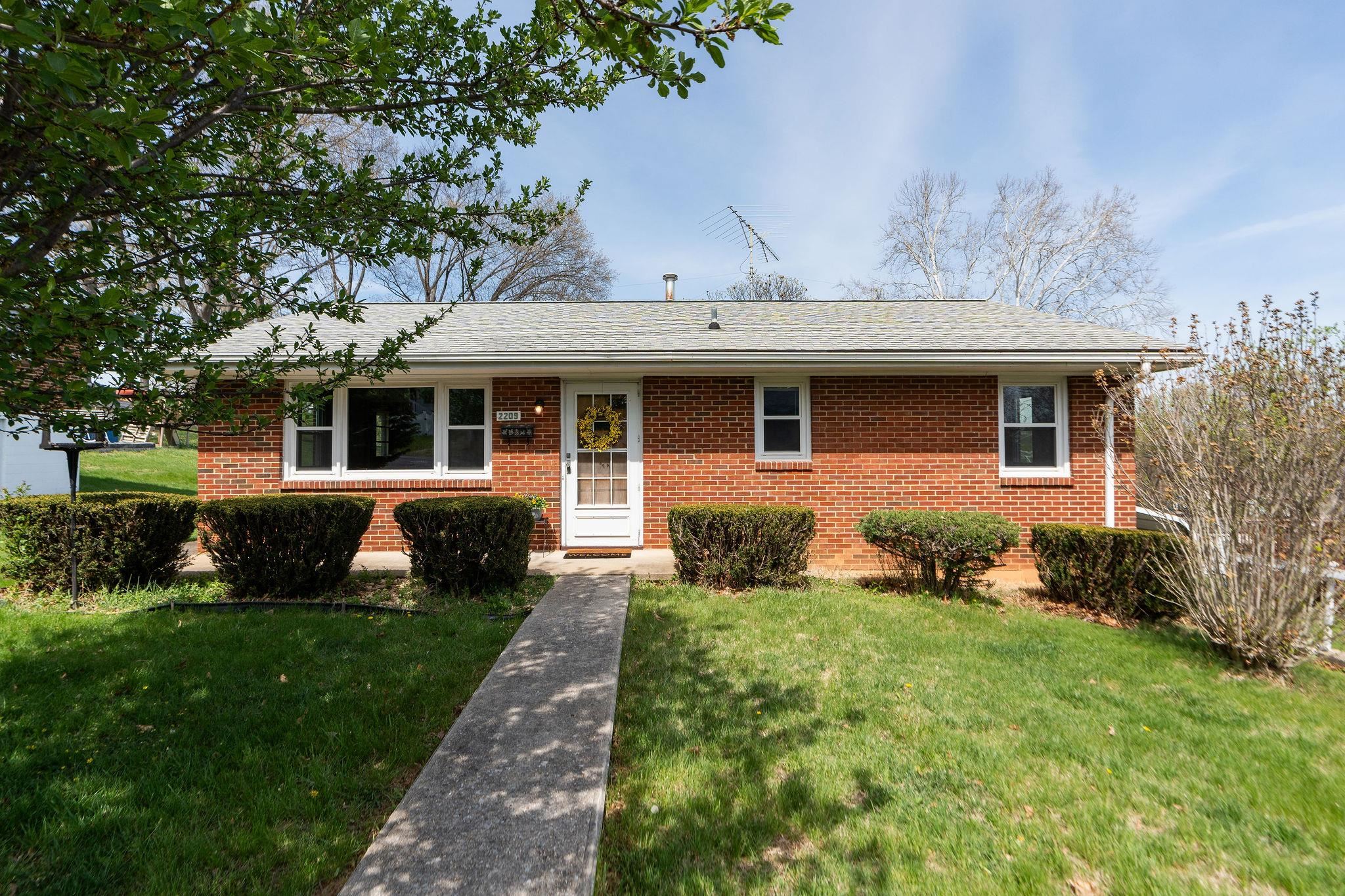 2209 3rd Street Staunton, VA 24401 - Photo 1 of 35 a front view of a house with garden