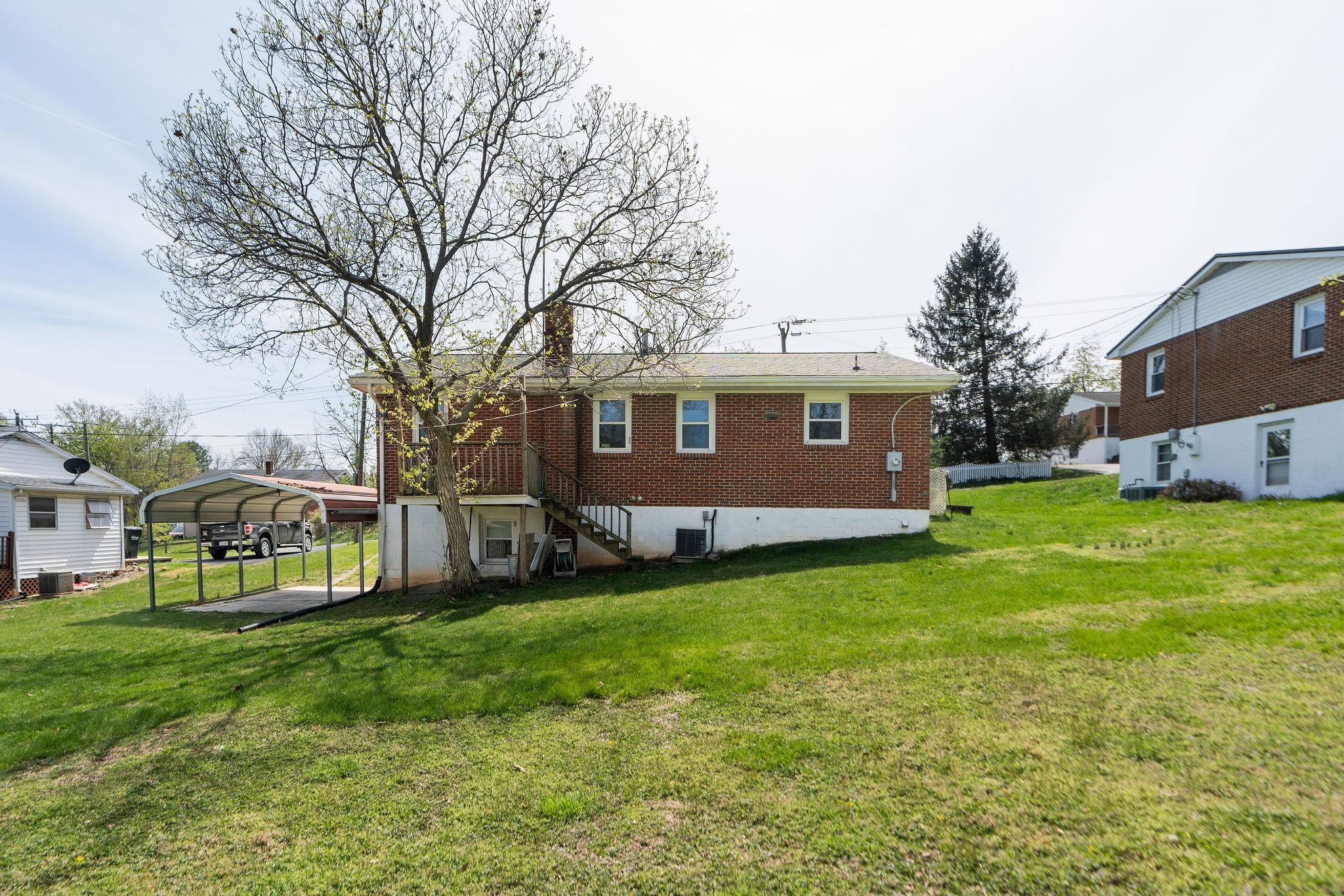 2209 3rd Street Staunton, VA 24401 - Photo 27 of 35 a view of a house with a big yard and large trees