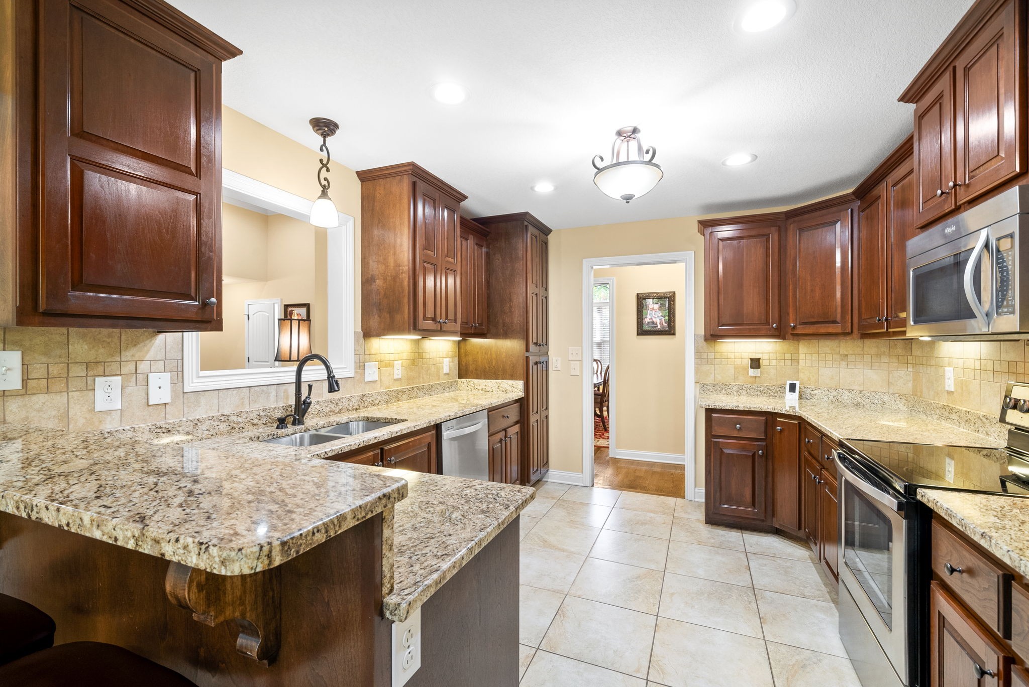 470 Salem Ridge Road Clarksville, TN 37040 - Photo 13 of 69 a kitchen with stainless steel appliances granite countertop a sink stove and refrigerator