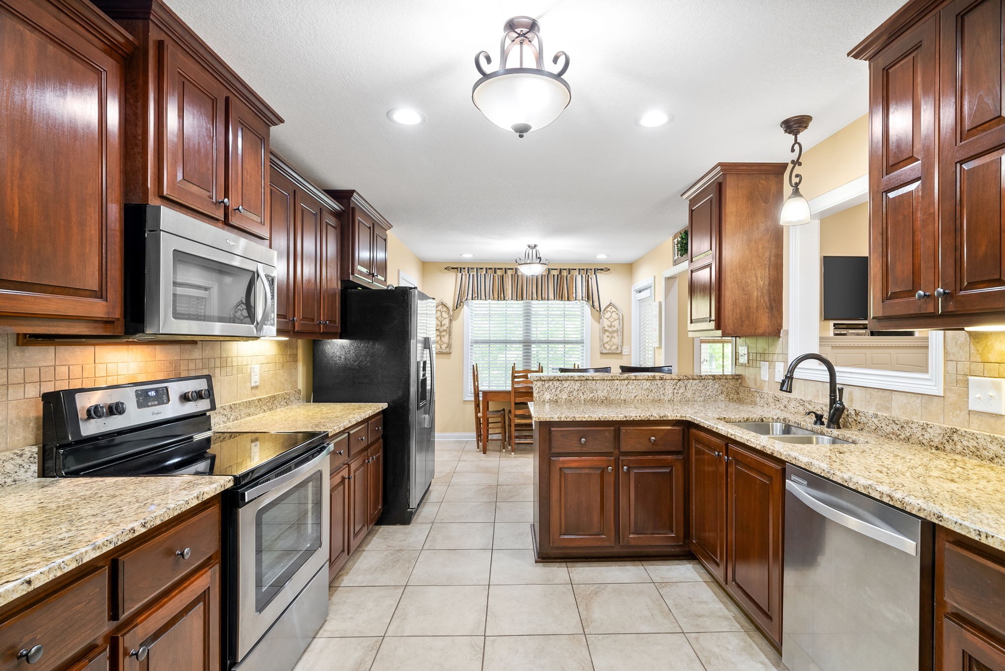 470 Salem Ridge Road Clarksville, TN 37040 - Photo 16 of 69 a kitchen with stainless steel appliances granite countertop a sink counter space cabinets and a stove