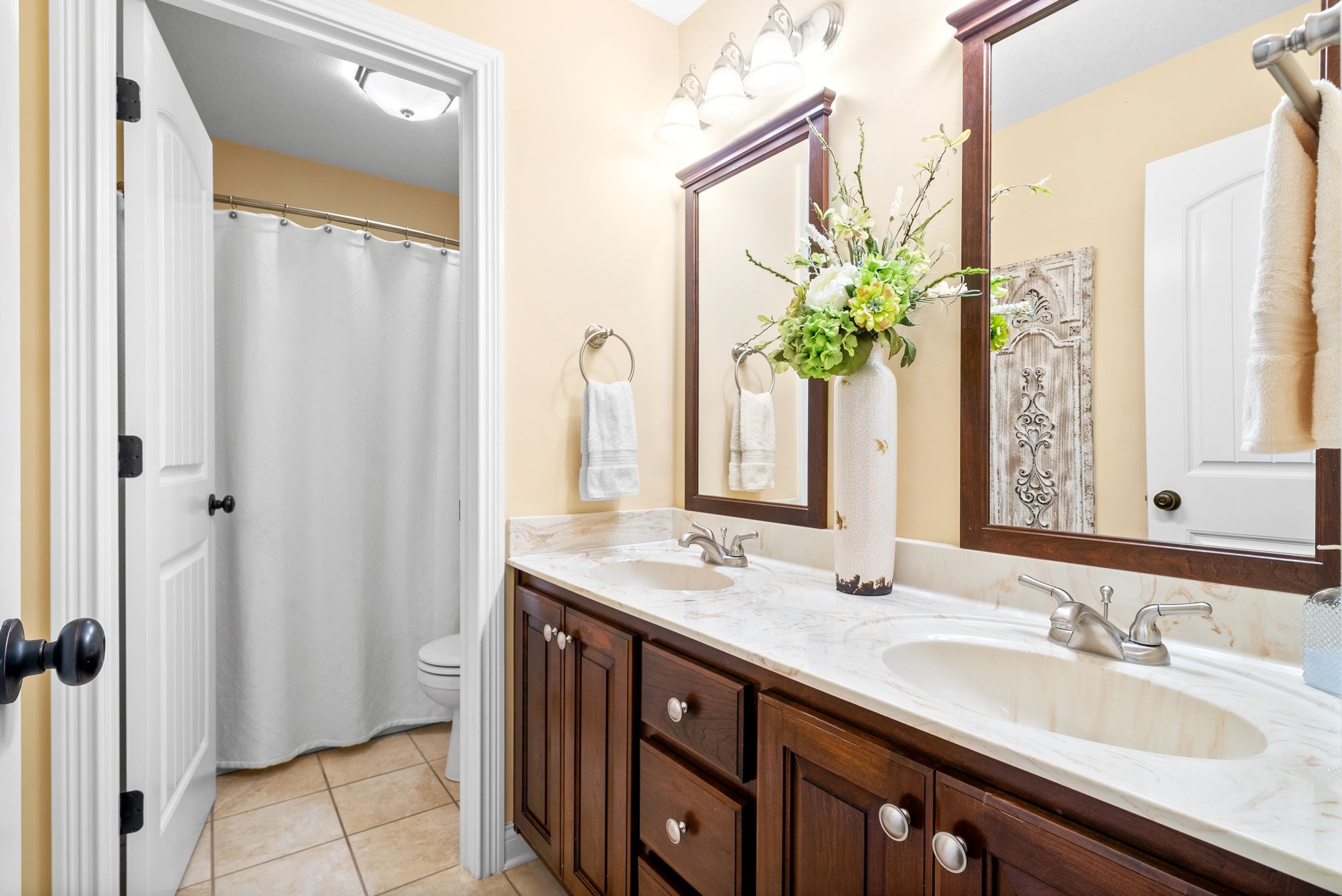 470 Salem Ridge Road Clarksville, TN 37040 - Photo 33 of 69 a bathroom with a double vanity sink and a mirror