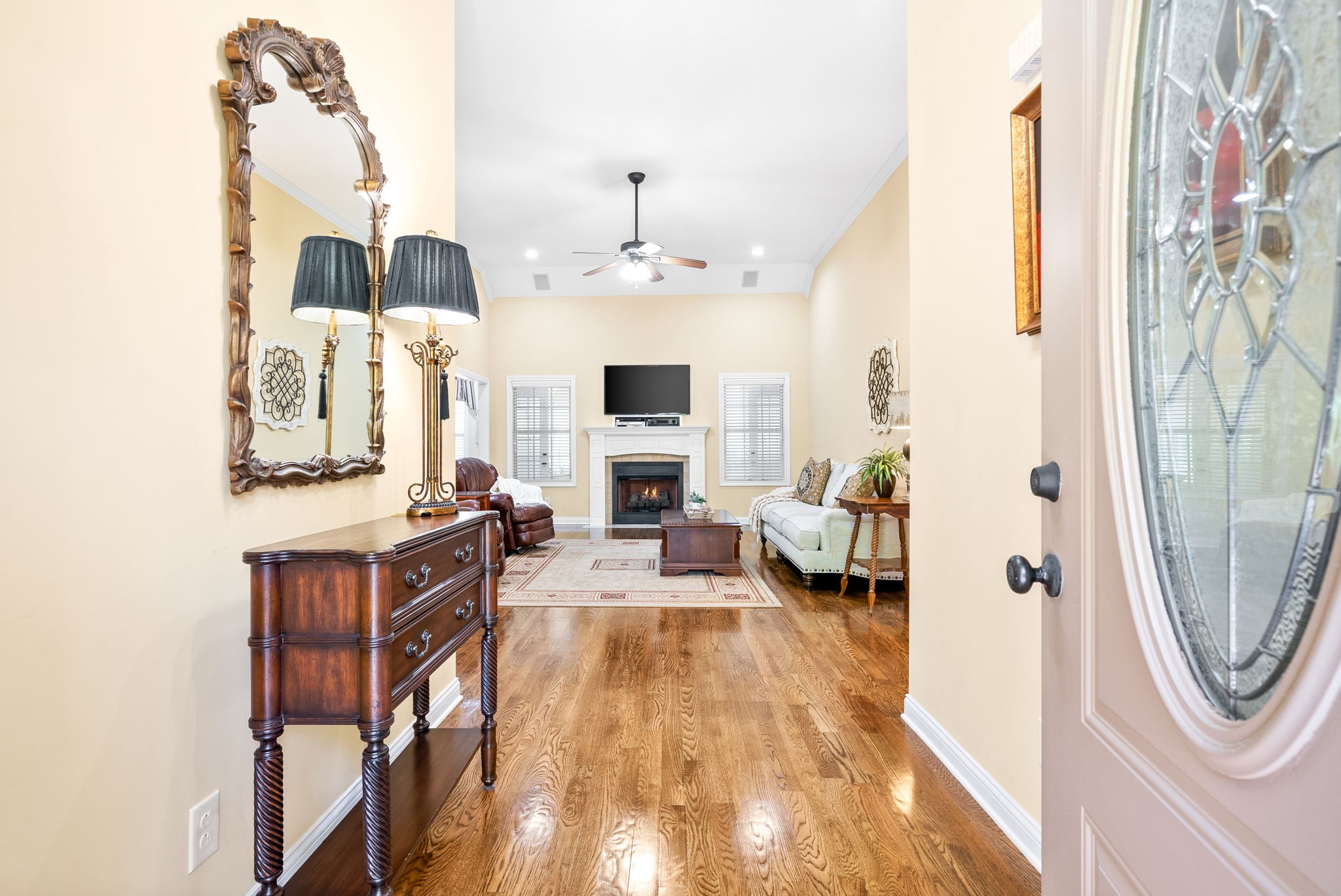 470 Salem Ridge Road Clarksville, TN 37040 - Photo 6 of 69 a living room with furniture a fireplace and a chandelier