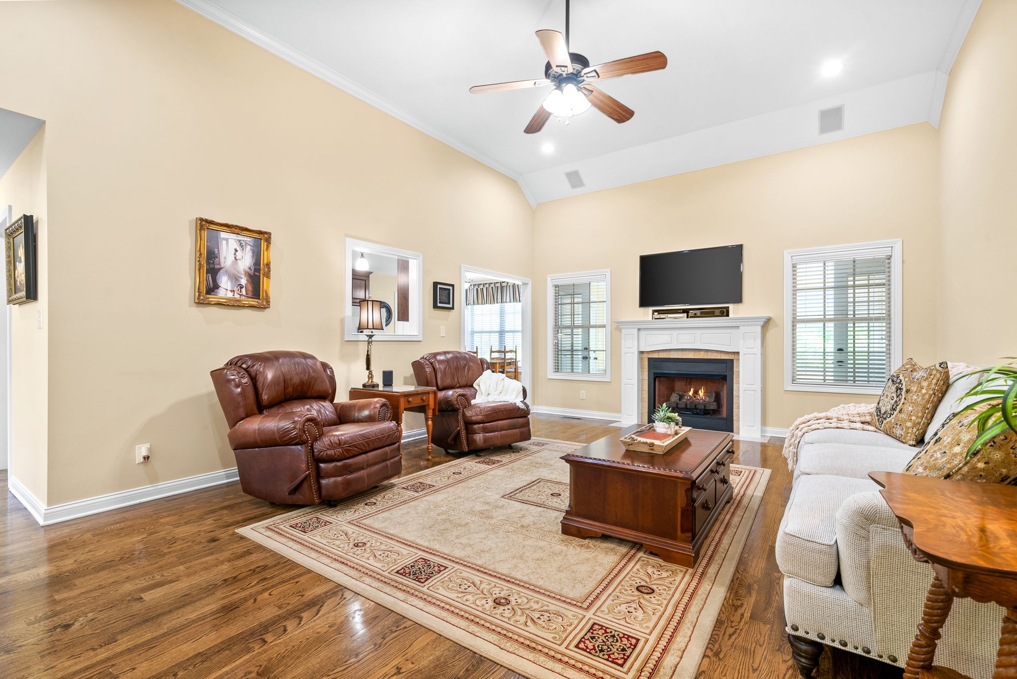 470 Salem Ridge Road Clarksville, TN 37040 - Photo 8 of 69 a living room with furniture a fireplace and a flat screen tv