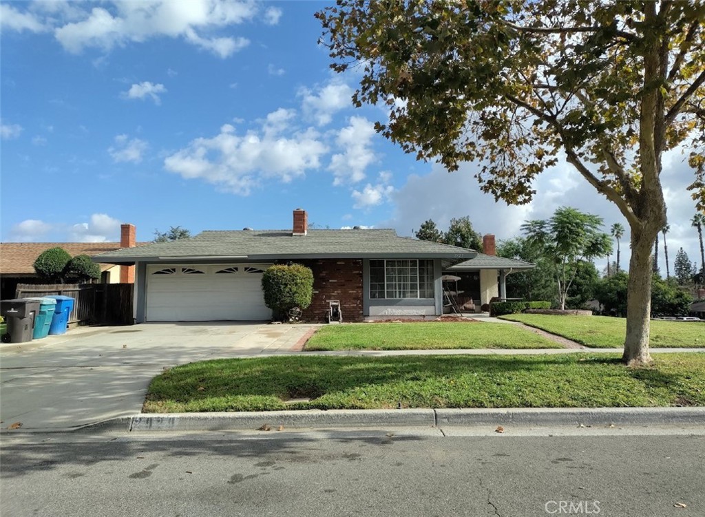 2929 Irving Street Riverside, CA 92504 - Photo 1 of 1 a front view of a house with a yard