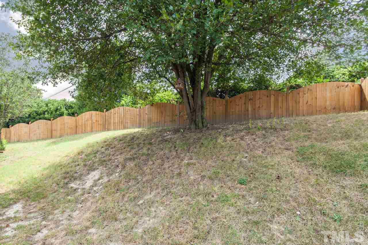 4312 Warfield Place Raleigh, NC 27604 - Photo 22 of 23 a view of backyard with tree