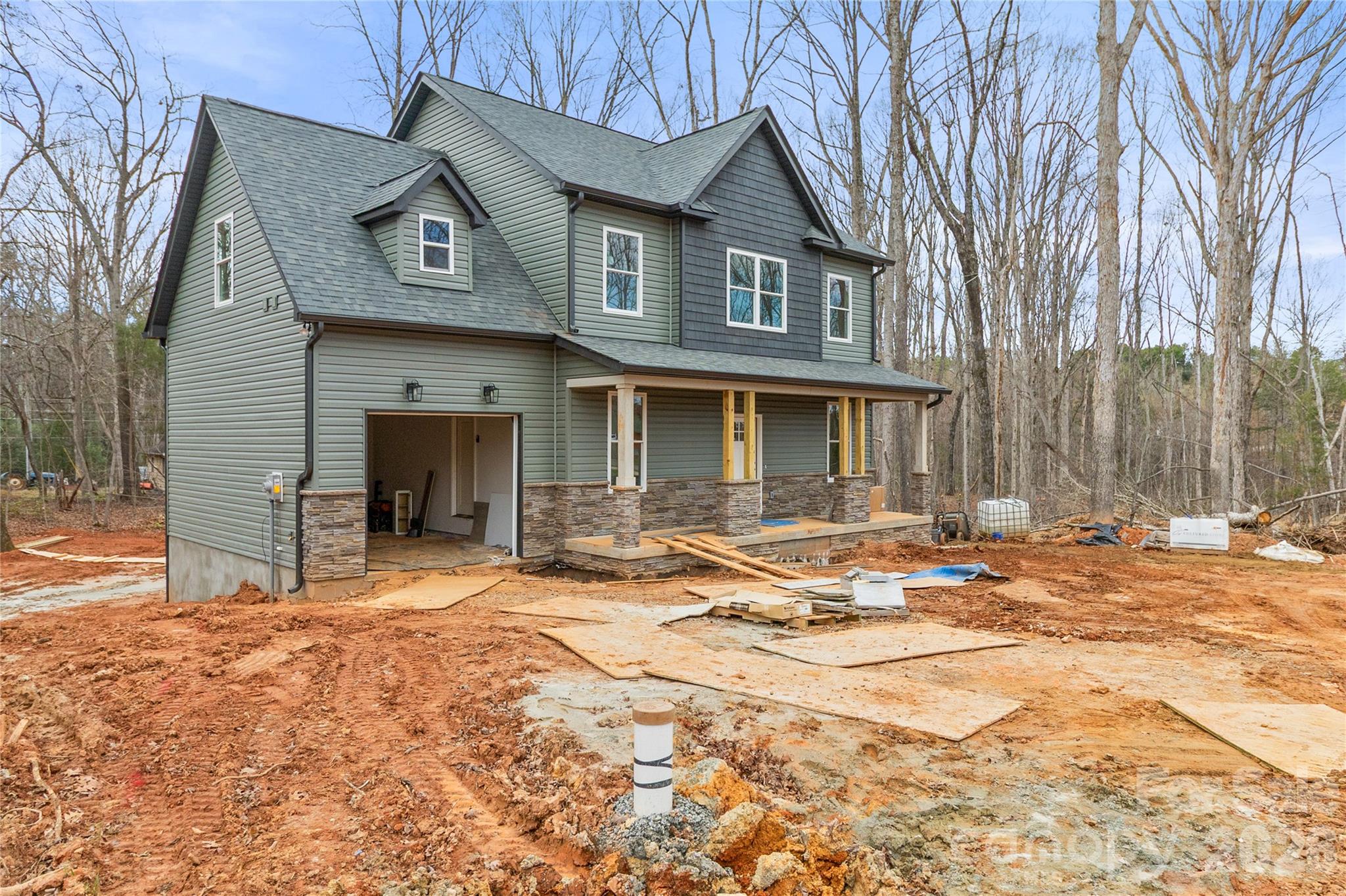 3692 Shannon Loop Denver, NC 28037 - Photo 2 of 47 a front view of a house with a patio