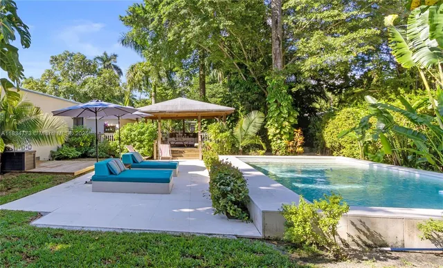 a view of a garden with patio