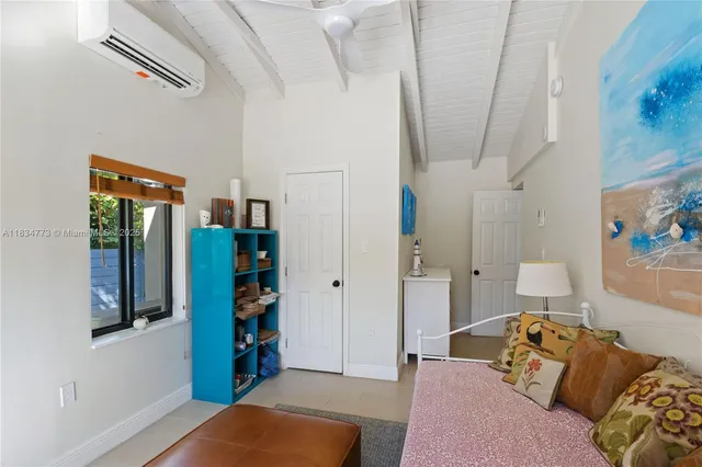 a living room with furniture and walk in closet