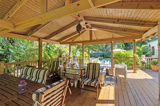 a view of a chairs and table in patio