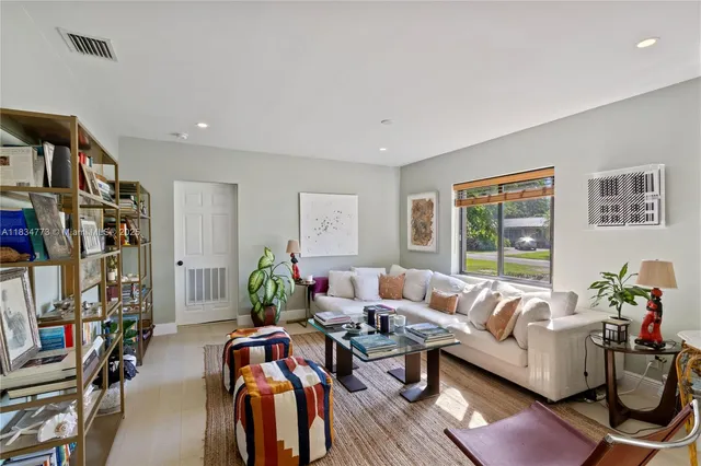 a living room with furniture or couch and a window