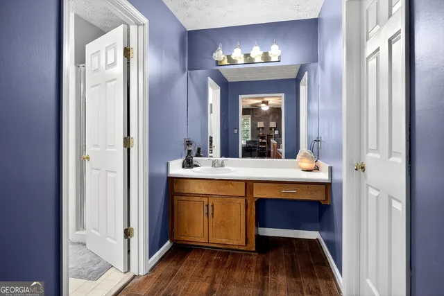 a view of bathroom with dual sinks