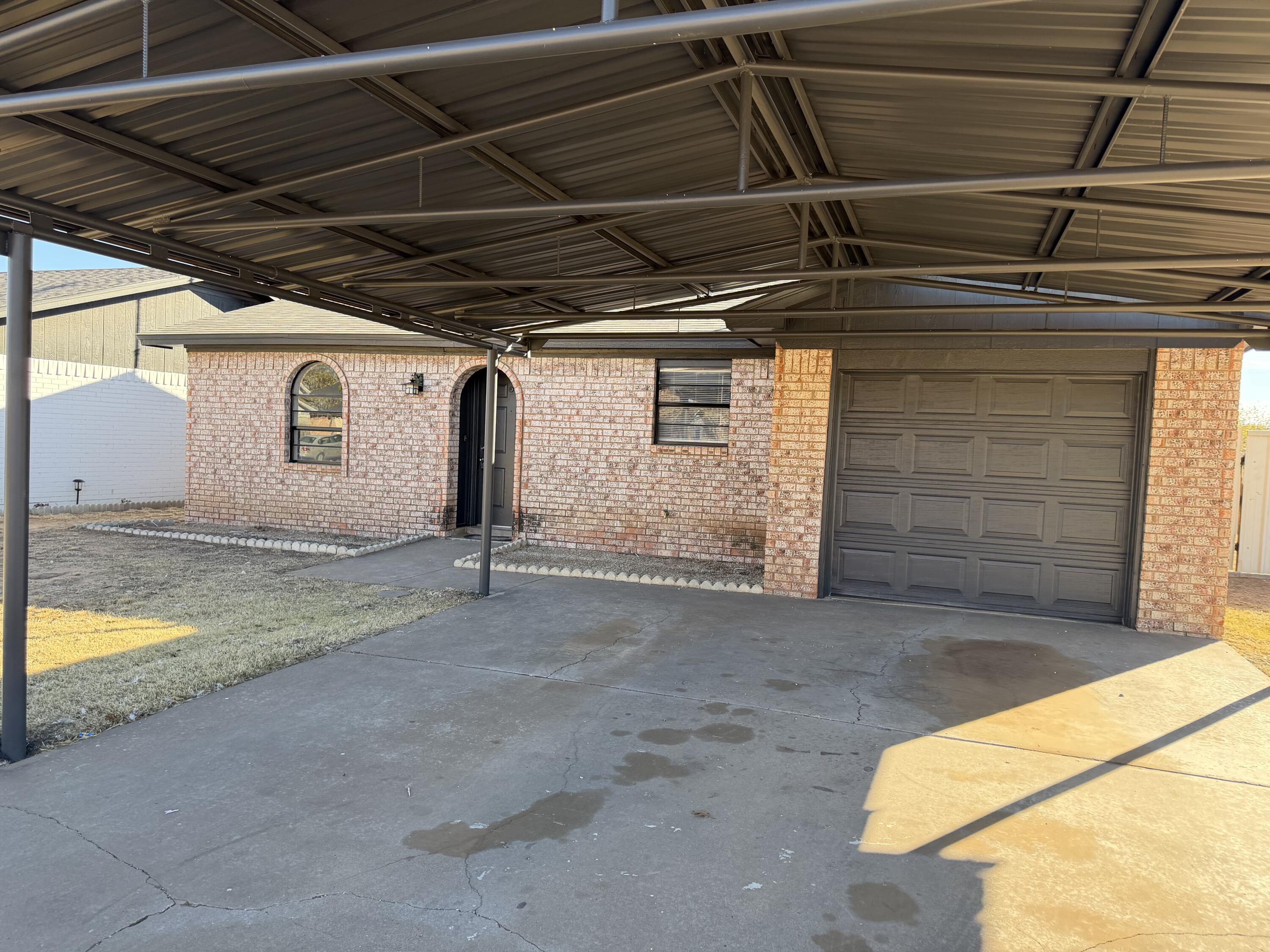 6315 29th Street Lubbock, TX 79407 - Photo 5 of 12 a view of a garage room