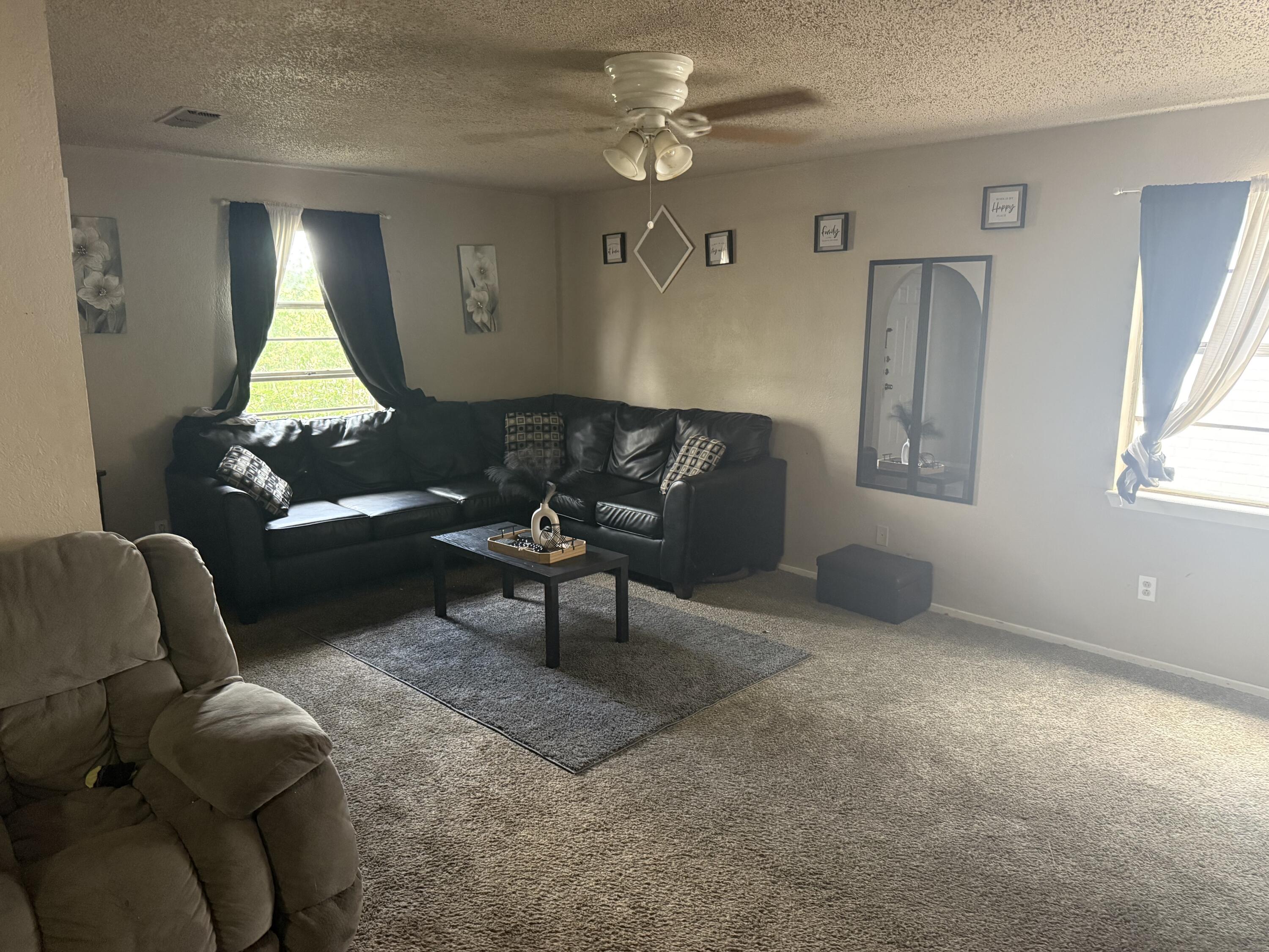 6315 29th Street Lubbock, TX 79407 - Photo 6 of 12 a living room with furniture and a window