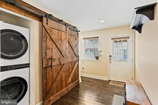 a view of a hallway with washer and dryer