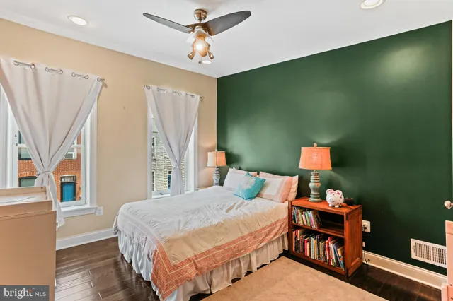 a bedroom with a bed closet and a window