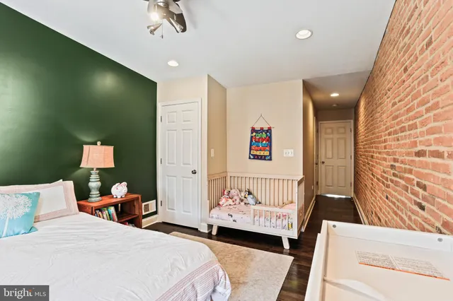 a bedroom with a bed and a couch