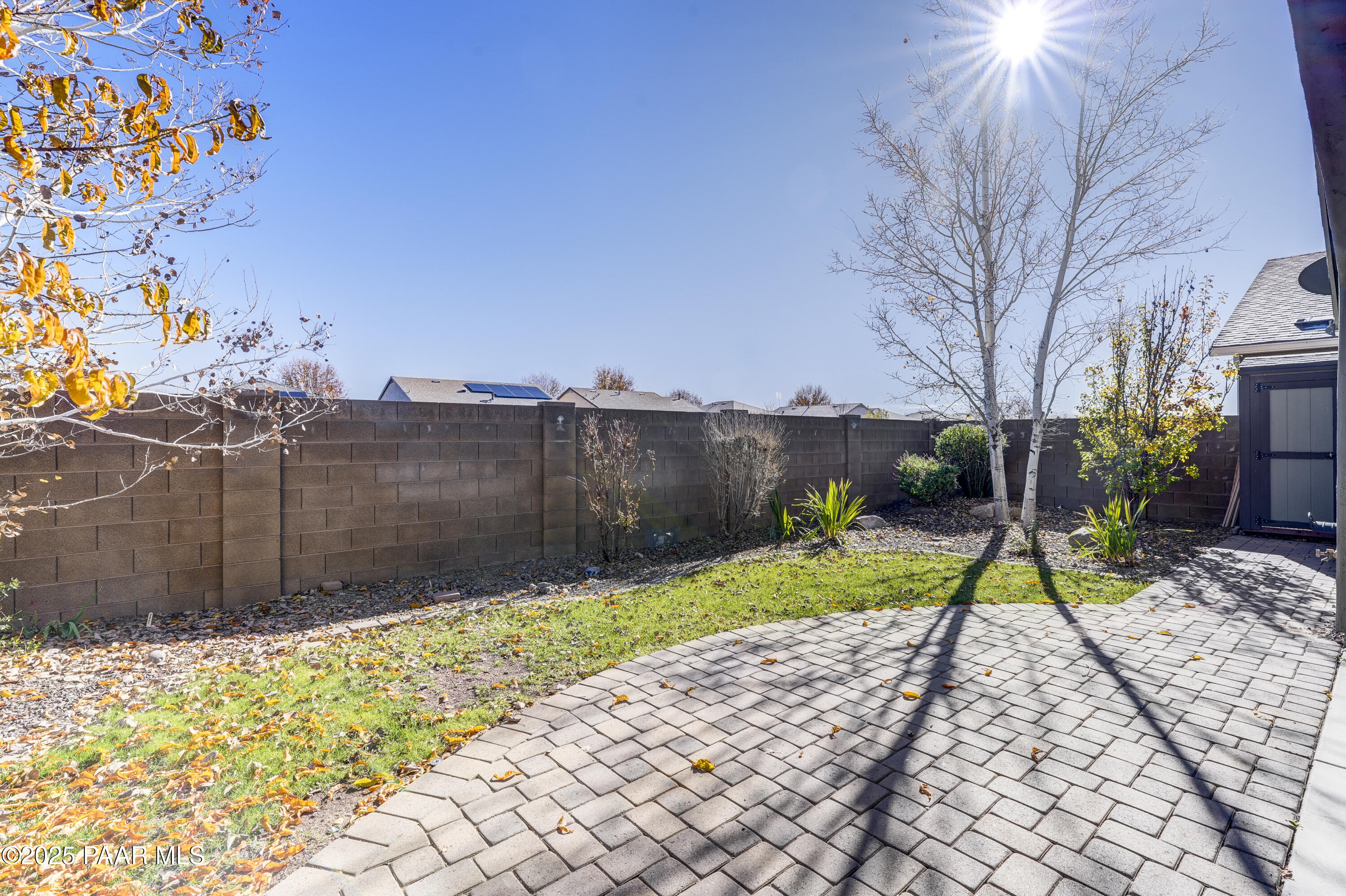 8147 North Racehorse Road Prescott Valley, AZ 86315 - Photo 23 of 27 a view of backyard with table and chairs plants and trees