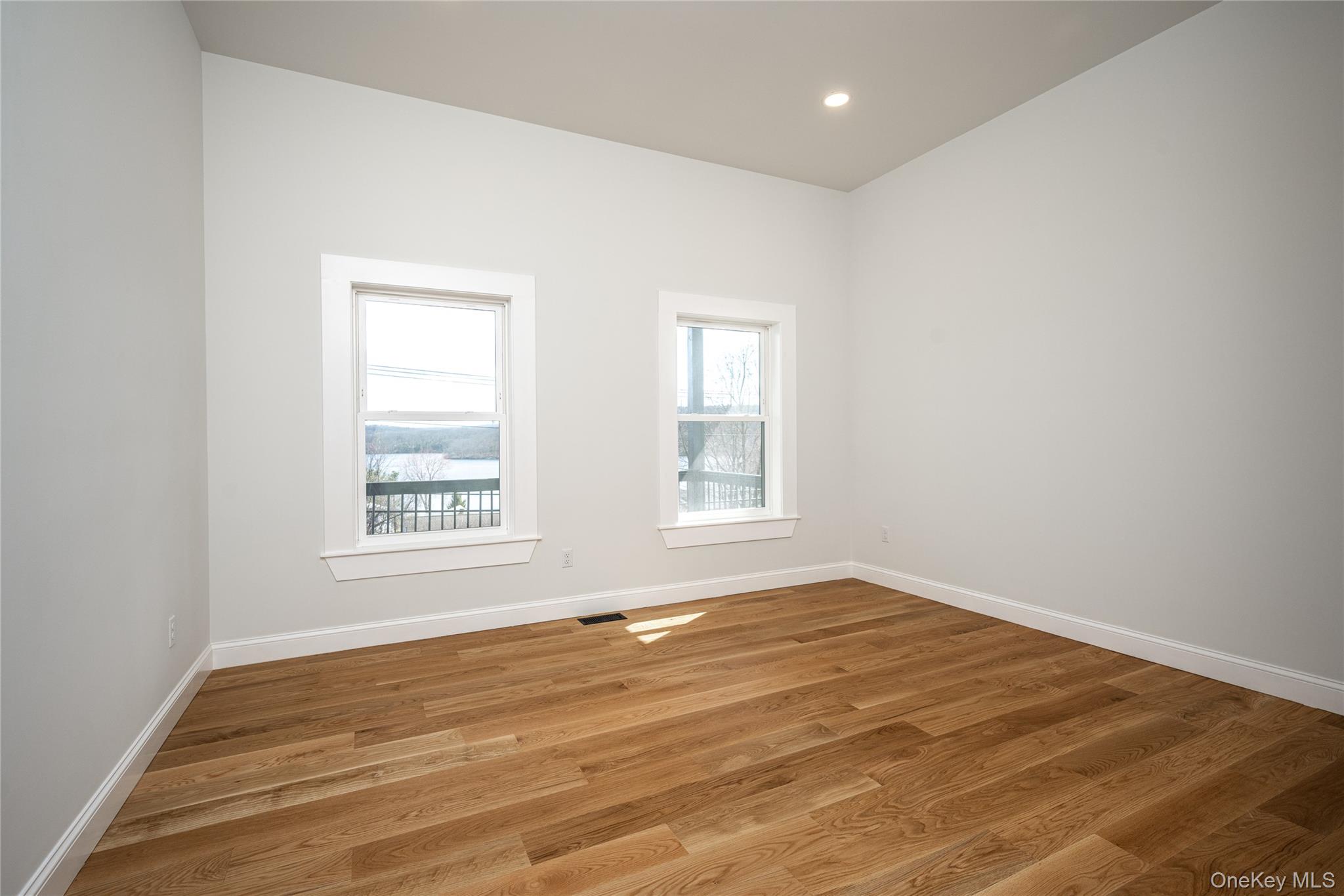 133 West Mombasha Road Monroe, NY 10950 - Photo 21 of 47 an empty room with wooden floor and windows