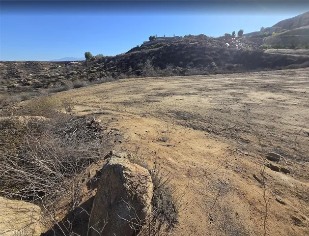 a view of ocean beach and mountain
