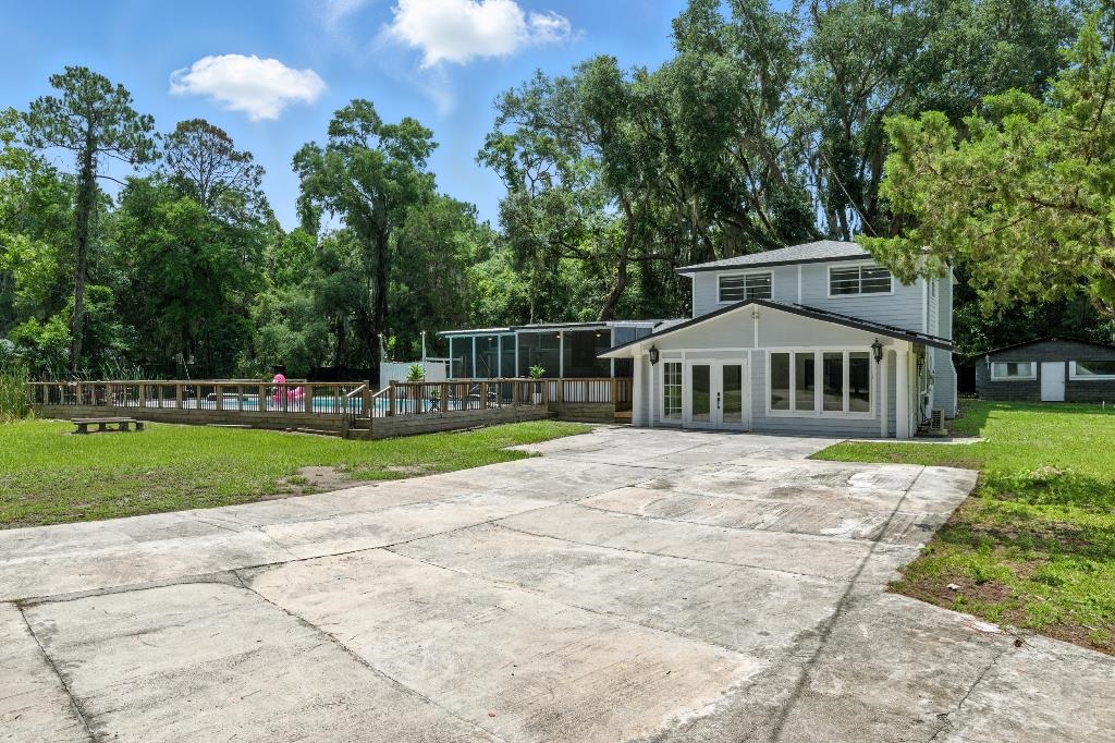 1637 Starratt Road Jacksonville, FL 32218 - Photo 12 of 44 a front view of a house with a yard