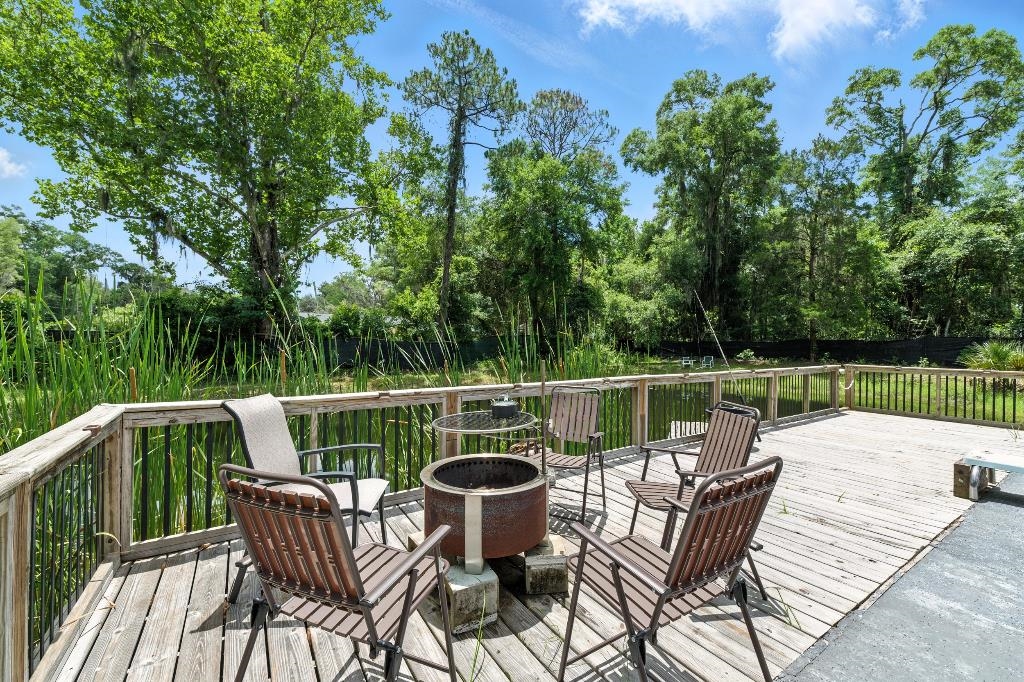 1637 Starratt Road Jacksonville, FL 32218 - Photo 14 of 44 a view of sitting space with furniture on wooden deck