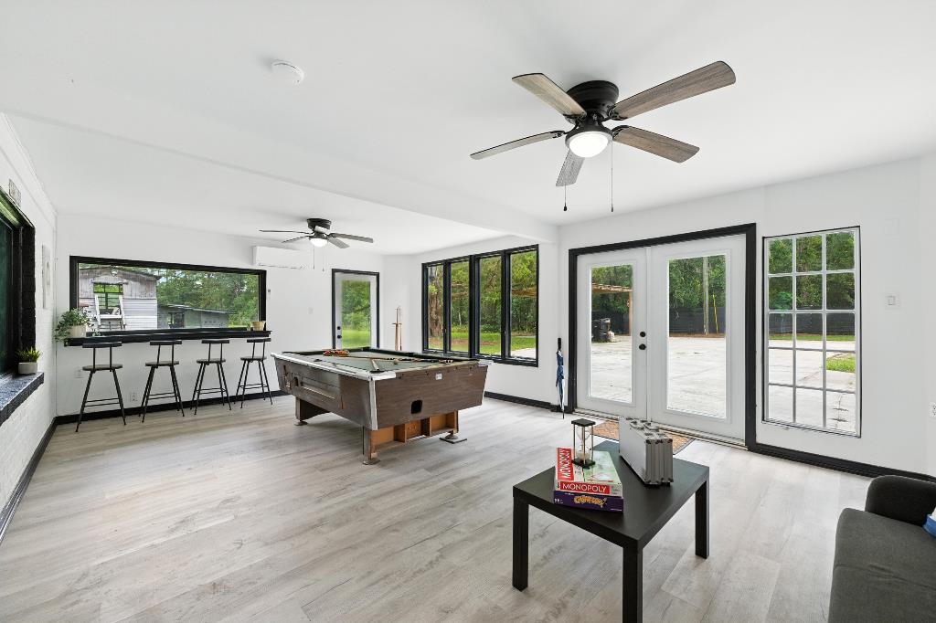 1637 Starratt Road Jacksonville, FL 32218 - Photo 15 of 44 a living room with furniture and a large window with wooden floor
