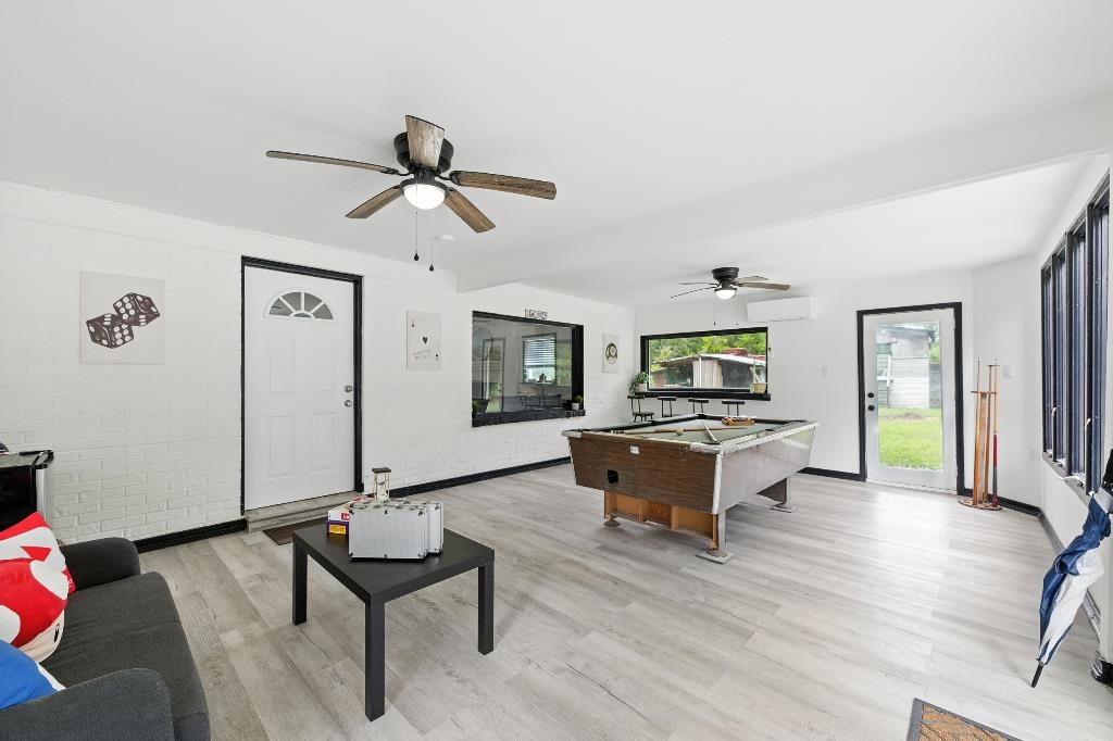 1637 Starratt Road Jacksonville, FL 32218 - Photo 16 of 44 a living room with furniture and a wooden floor