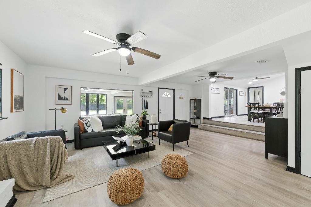 1637 Starratt Road Jacksonville, FL 32218 - Photo 17 of 44 a living room with furniture and a chandelier
