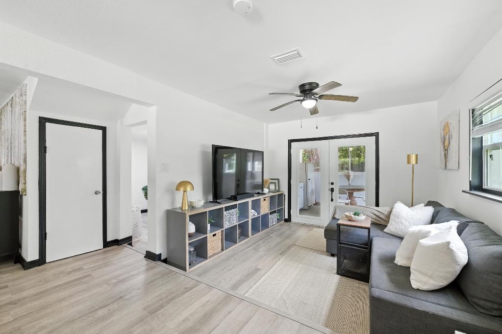 1637 Starratt Road Jacksonville, FL 32218 - Photo 19 of 44 a living room with furniture and a flat screen tv