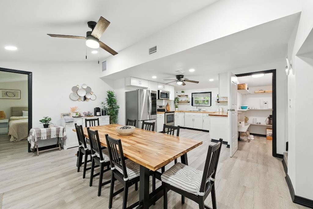 1637 Starratt Road Jacksonville, FL 32218 - Photo 22 of 44 a view of a dining room with furniture and wooden floor