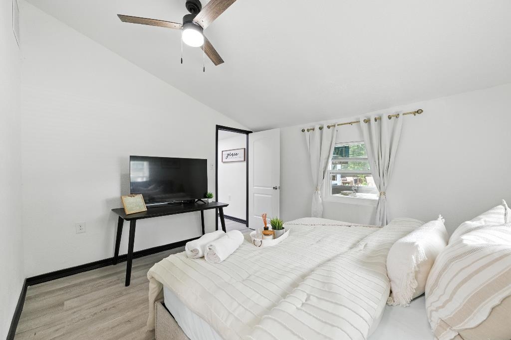 1637 Starratt Road Jacksonville, FL 32218 - Photo 27 of 44 a bedroom with a bed and a flat screen tv