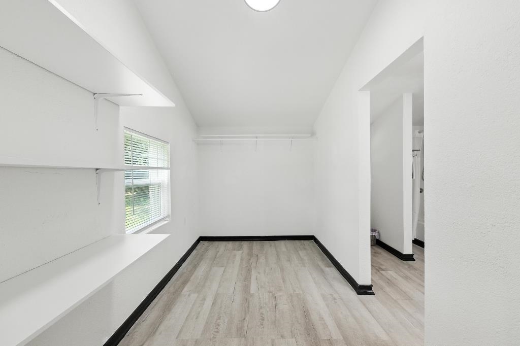 1637 Starratt Road Jacksonville, FL 32218 - Photo 28 of 44 an empty room with wooden floor and windows