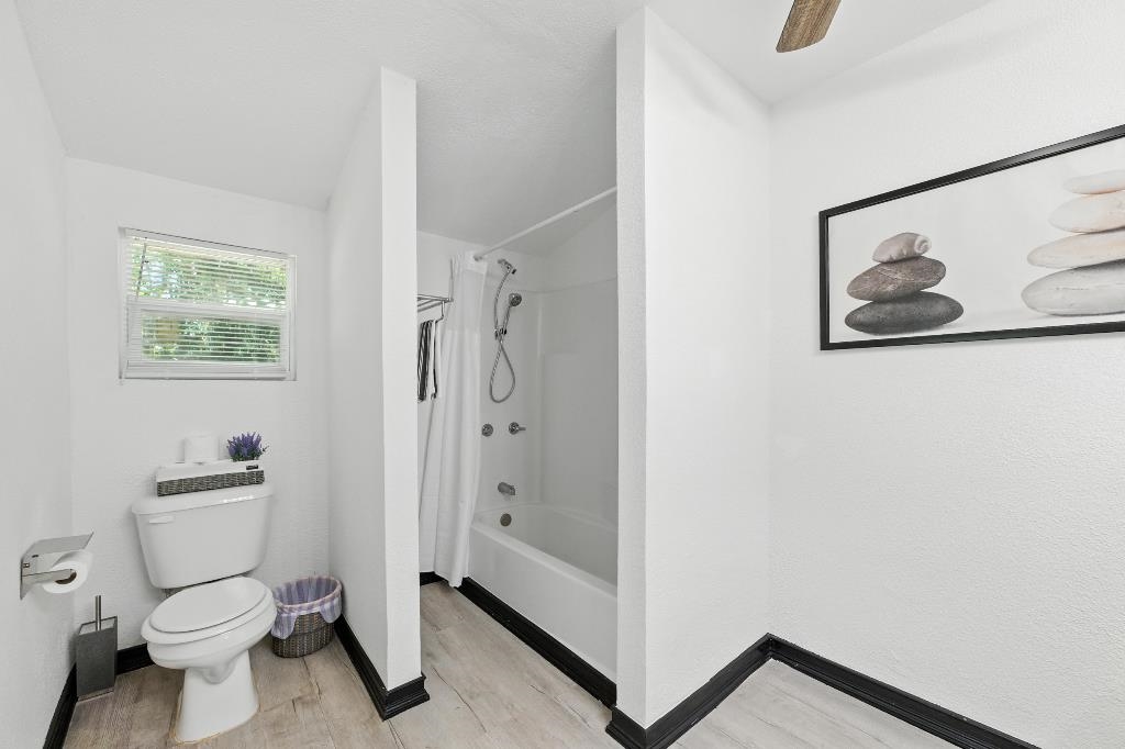 1637 Starratt Road Jacksonville, FL 32218 - Photo 30 of 44 a bathroom with a toilet sink and shower