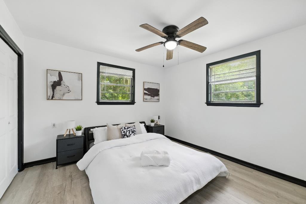 1637 Starratt Road Jacksonville, FL 32218 - Photo 31 of 44 a bedroom with a large bed and a chandelier