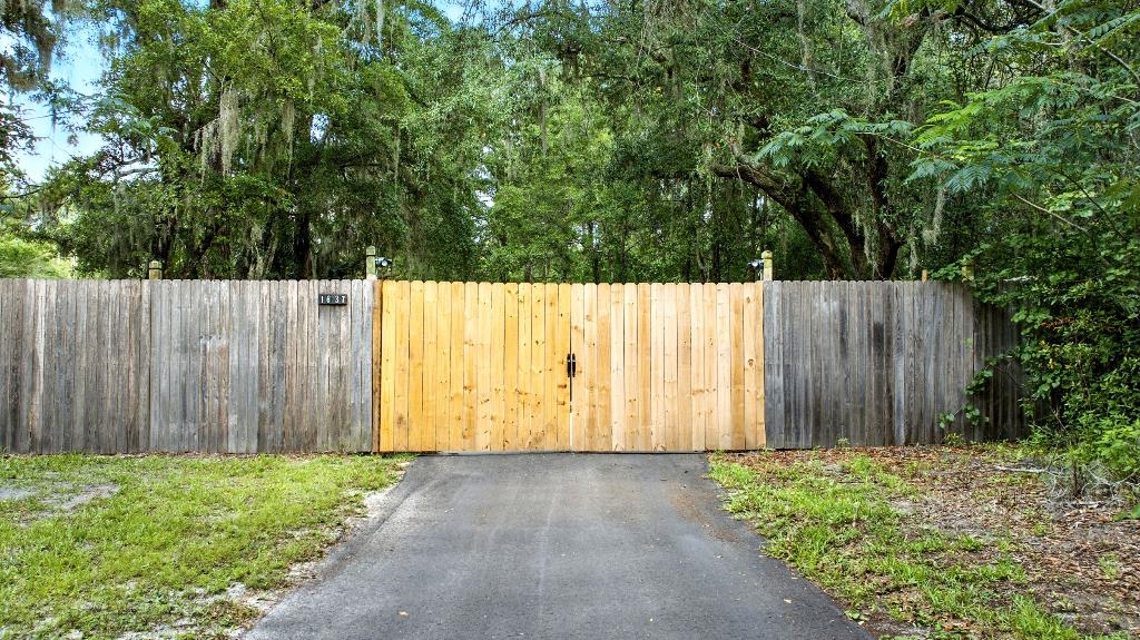 1637 Starratt Road Jacksonville, FL 32218 - Photo 38 of 44 a view of outdoor space with wooden fence