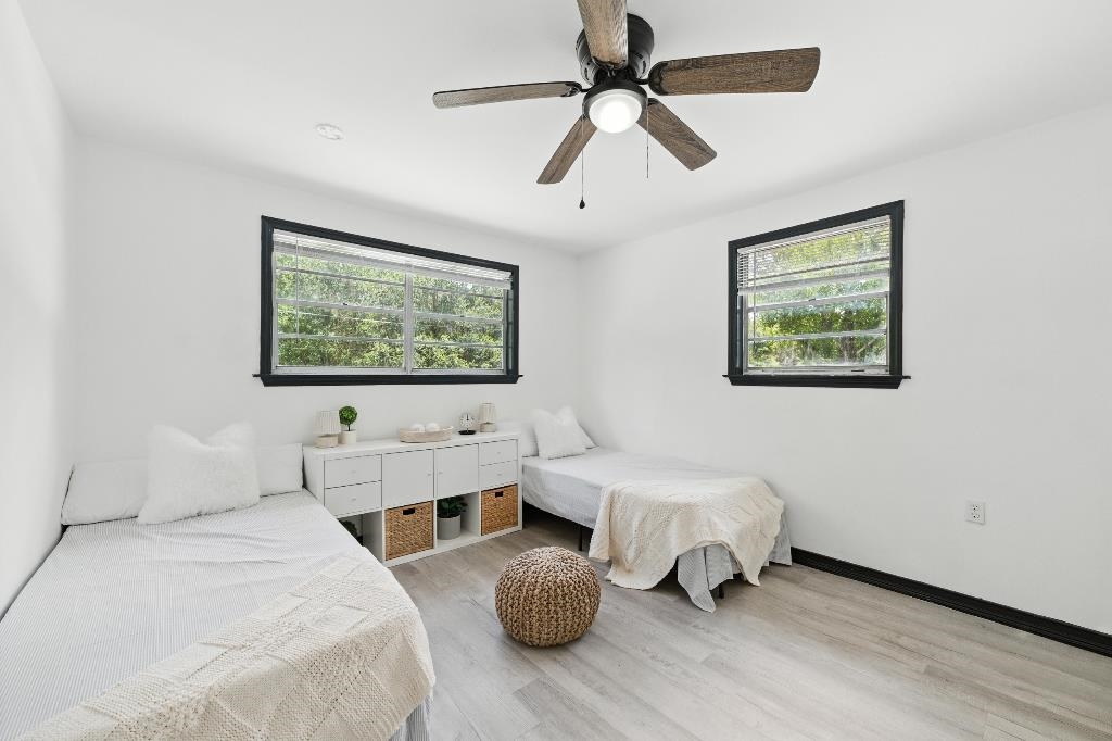 1637 Starratt Road Jacksonville, FL 32218 - Photo 4 of 44 a bedroom with a bed and a large window