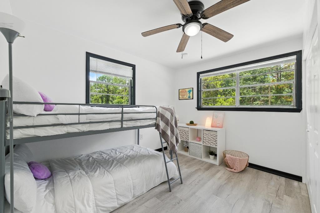 1637 Starratt Road Jacksonville, FL 32218 - Photo 5 of 44 a bedroom with furniture and a window