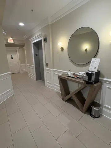 a kitchen with a sink and a mirror