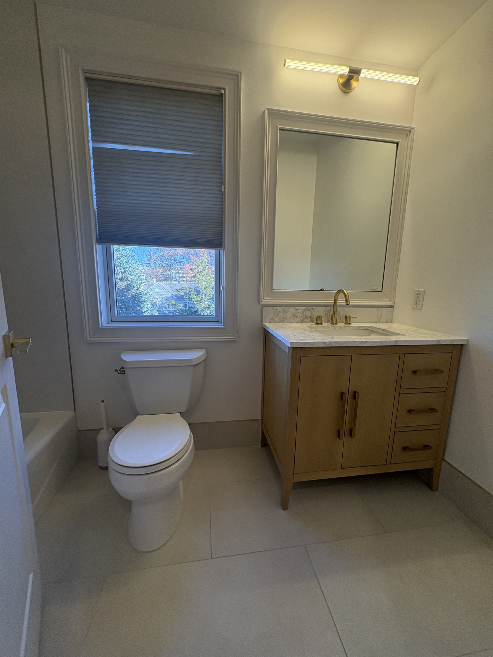 21 Seir Hill Road, Unit 6 Norwalk, CT 06850 - Photo 11 of 22 a bathroom with a toilet sink and mirror