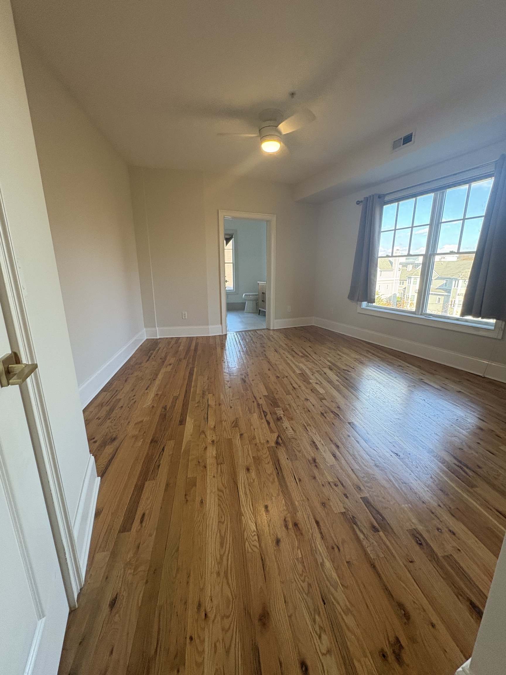 21 Seir Hill Road, Unit 6 Norwalk, CT 06850 - Photo 13 of 22 wooden floor in an empty room with a window