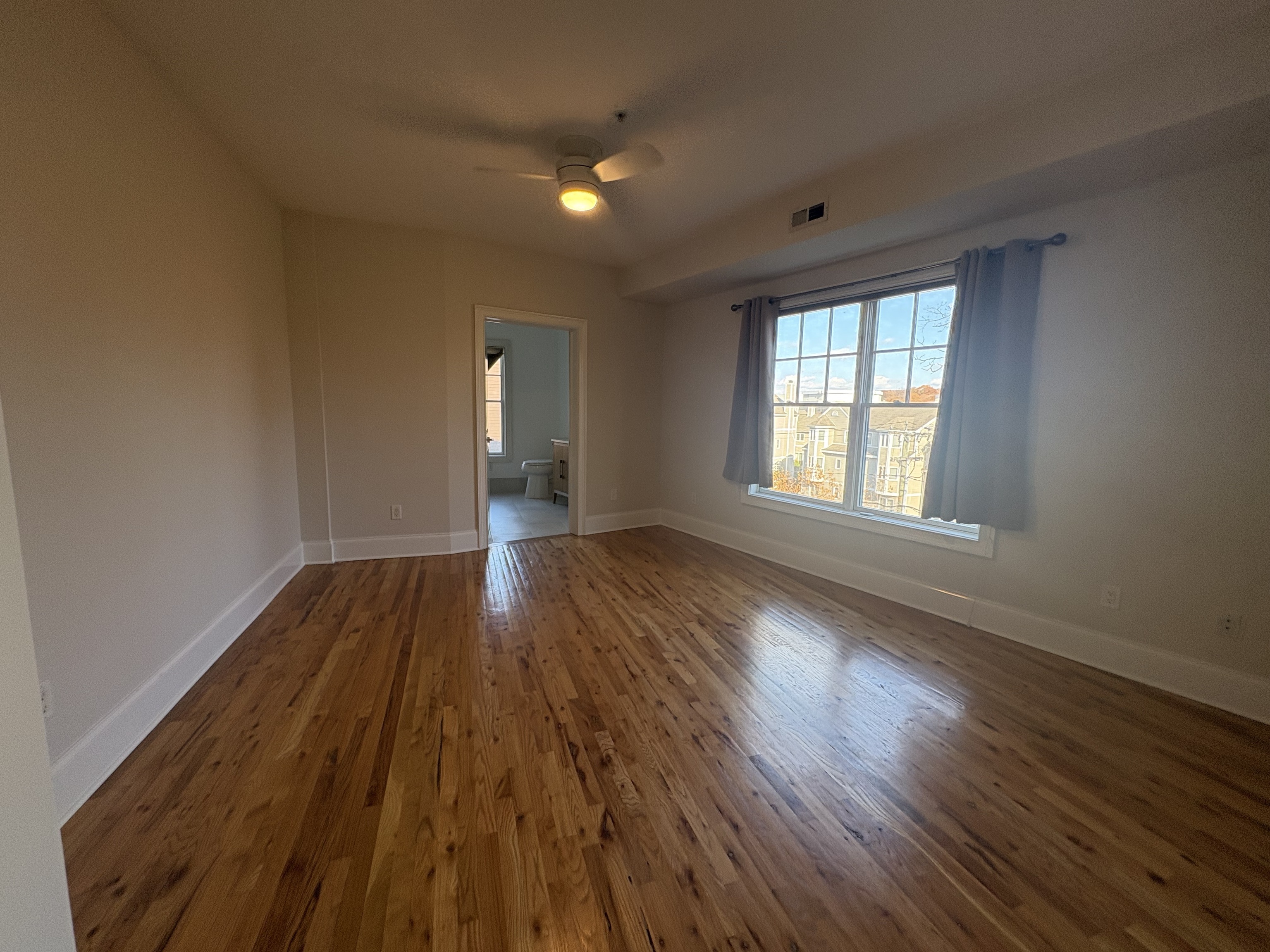 21 Seir Hill Road, Unit 6 Norwalk, CT 06850 - Photo 15 of 22 wooden floor in an empty room with a window